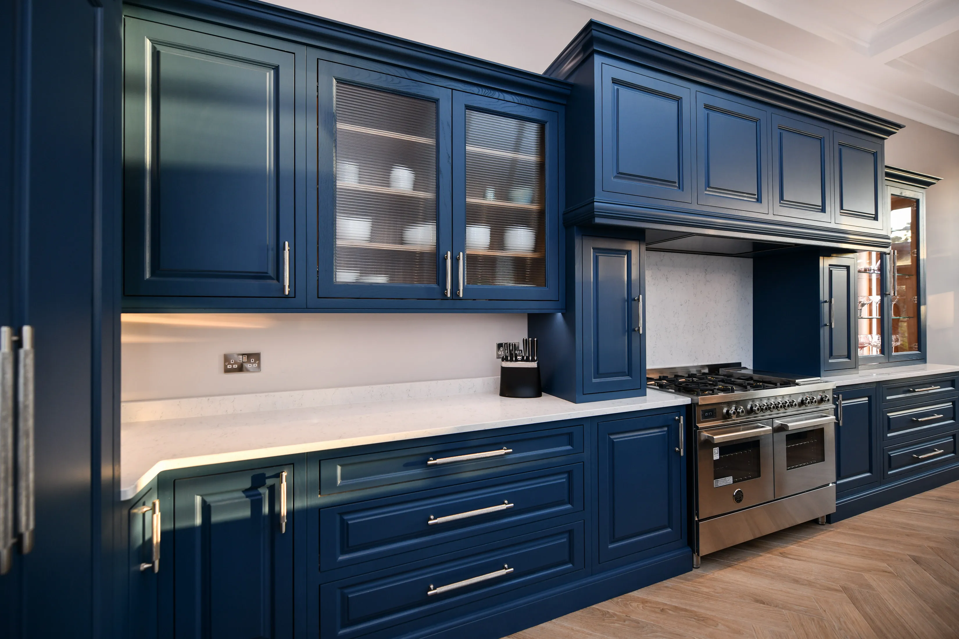 Large hand crafted kitchen with double oven cooker with large drawers, storage and display cupboards